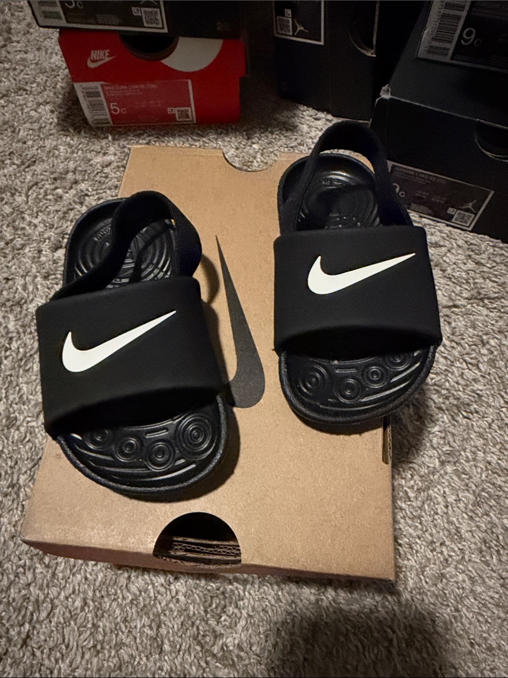 Nike Kids Black Slides with White Swoosh